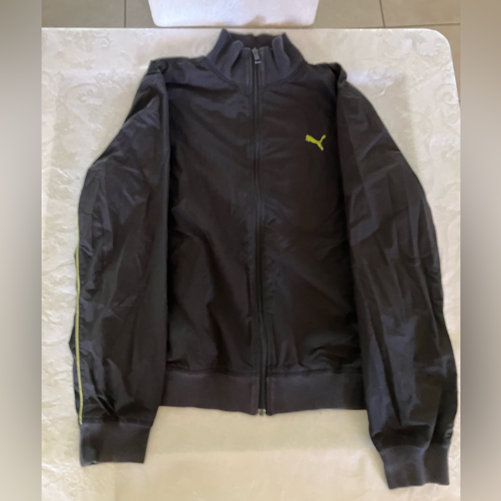 Puma Men's Black Windbreaker with fluorescent green accent.